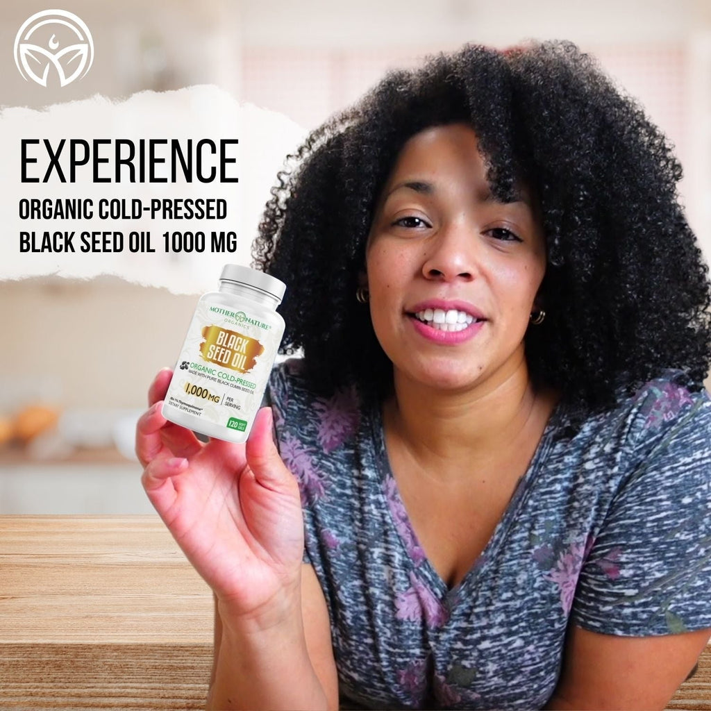 Woman holding a bottle of Mother Nature Organics Organic Cold-Pressed Black Seed Oil Softgels 1000 mg